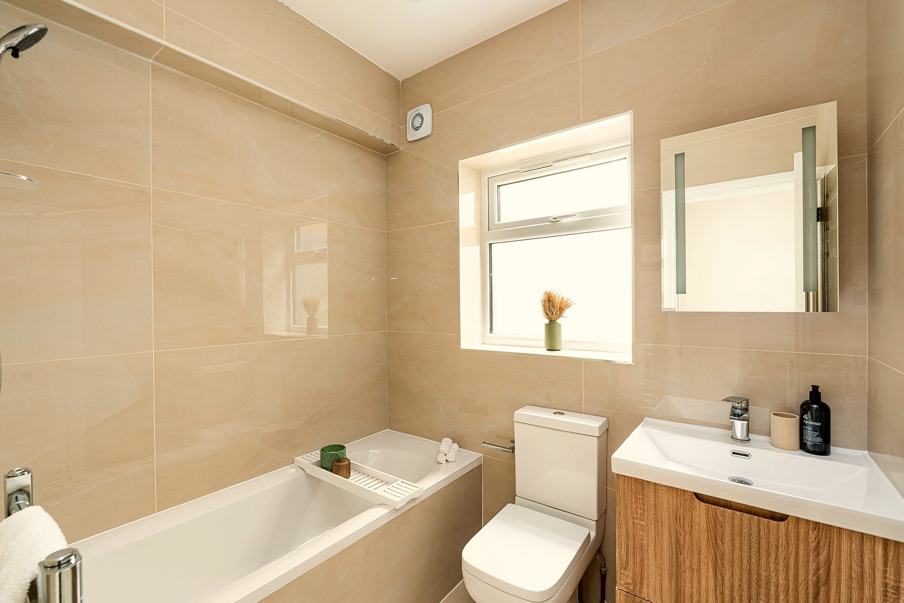 Stone-toned family bathroom